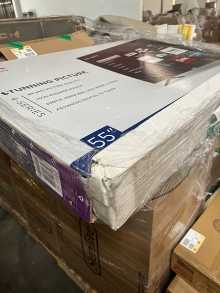Picture of the top of a pallet of goods with a 55-inch LCD TV box on top