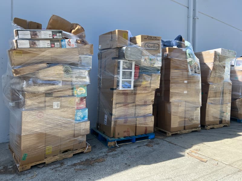 Picture of many pallets outside the warehouse with many assorted boxes